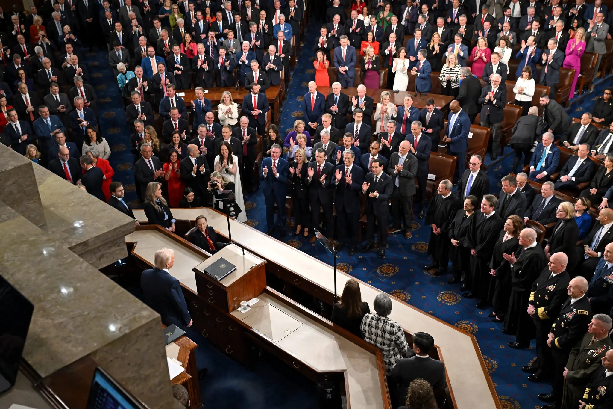 In a lengthy speech, President Trump promoted his administration’s rapid early moves and reprised the themes of his campaign, vowing to crack down on illegal immigration and “wokeness.”